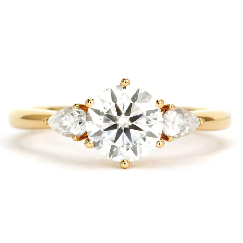 Charlize Round Moissanite with Pear Side Stones Trilogy Ring in 18K gold - LeCaine Gems