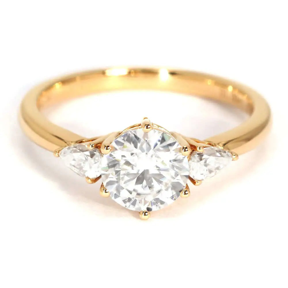 Charlize Round Moissanite with Pear Side Stones Trilogy Ring in 18K gold - LeCaine Gems