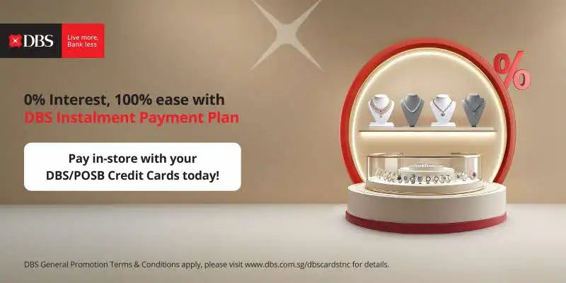 Gold diamond necklace with a red dbs logo on the box.